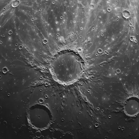 „Sattelite camera shot of the moon’s surface with visible craters and textures“